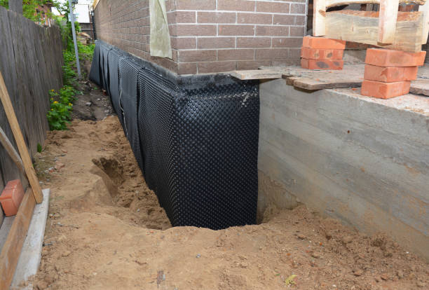 SJ Waterproofing Pros technician performing targeted Basement Waterproofing assessment in Germantown, TN